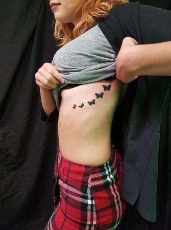 zwarte vlinders tattoo